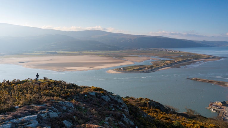 Visitor walking along the peak in Barmouth, South Snowdonia, Wales